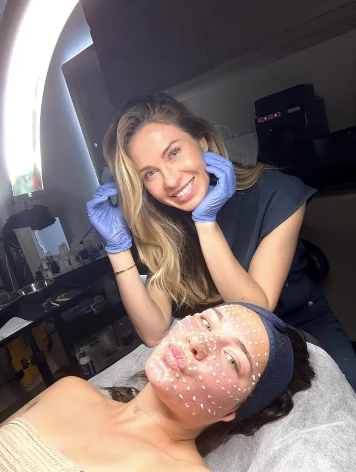 Tatsiana with a client during a facial treatment at Revive Point